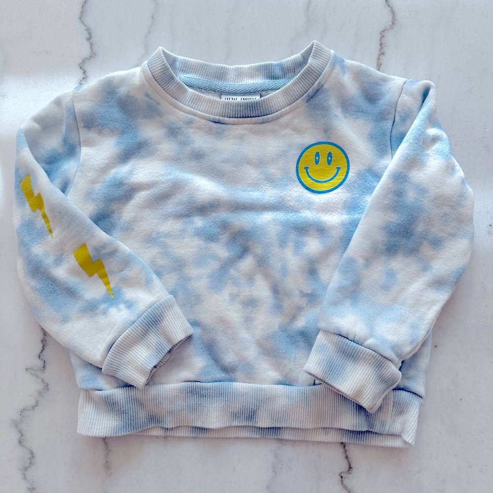 Little Trouble Toddler lightning Tie-Dye Pullover sweatshirt.